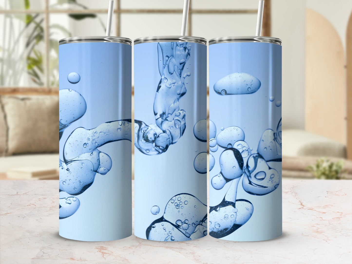 Three tall tumblers with abstract blue liquid and bubble graphics.