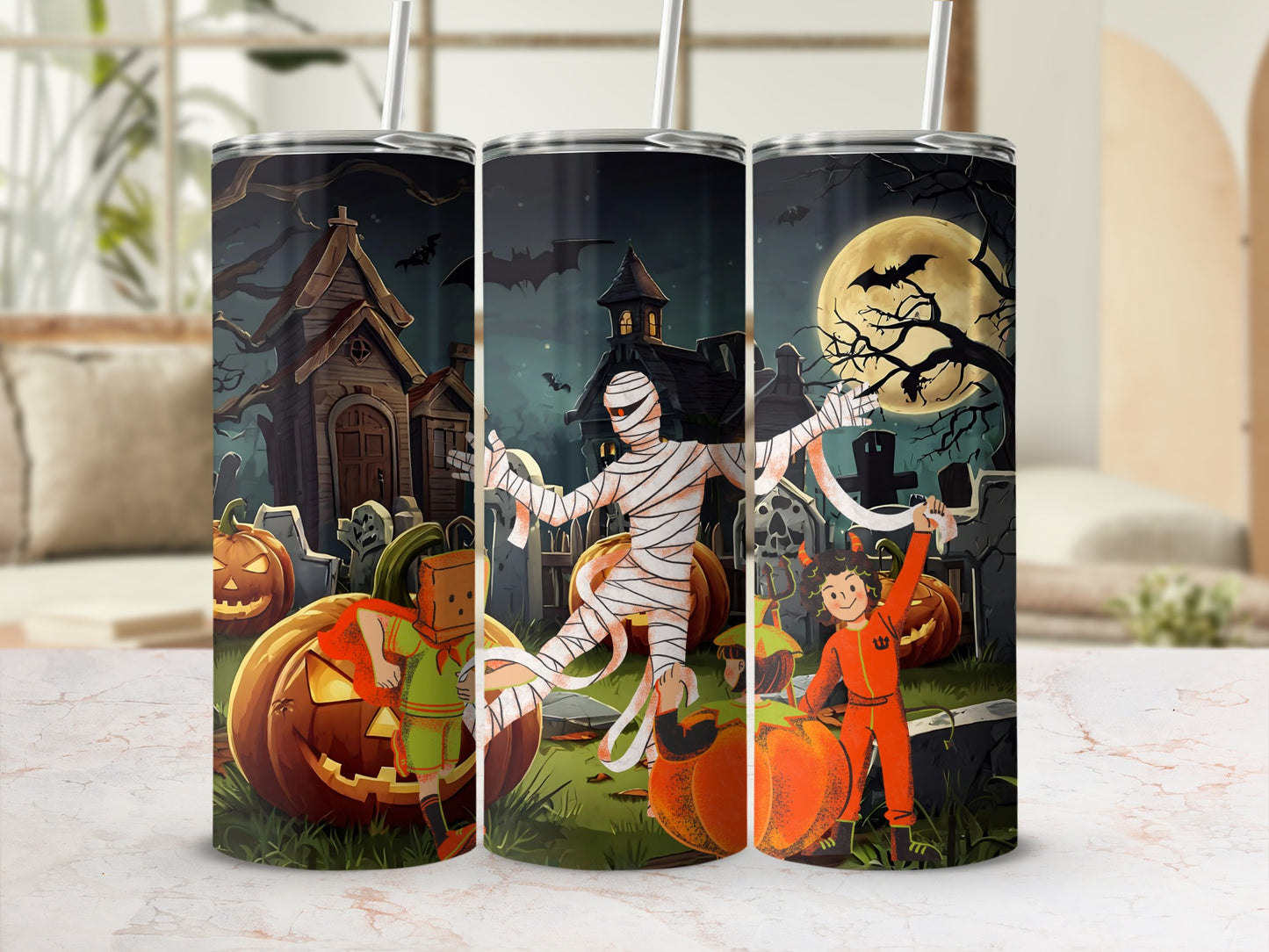 Halloween themed tumbler with cartoon mummy, kids in costumes, pumpkins, and spooky house.