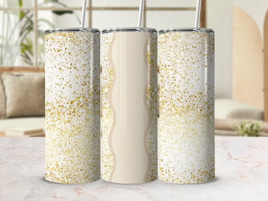 Three glitter-covered tumblers with straws on a marble surface.