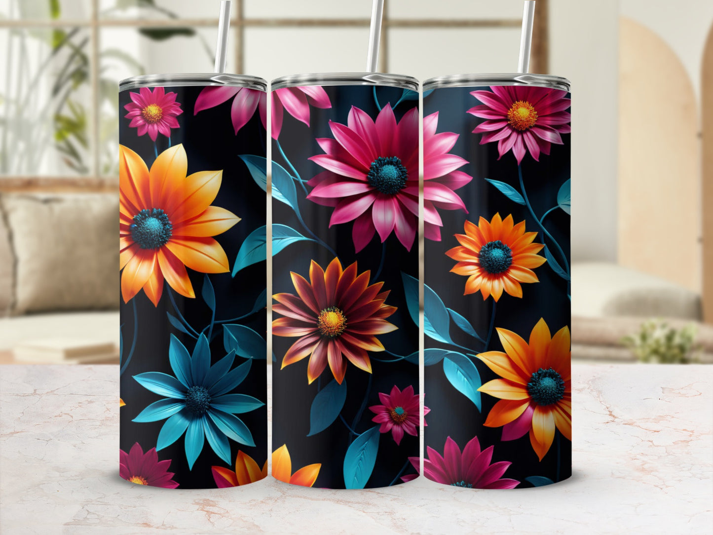 Three tumblers with vibrant floral designs in orange, pink, and teal on a dark background.