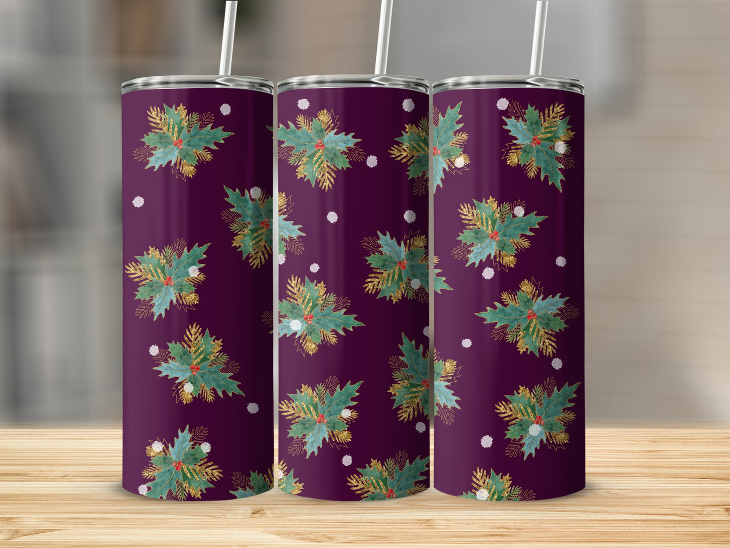 Three purple tumblers with a festive green and gold holly pattern.