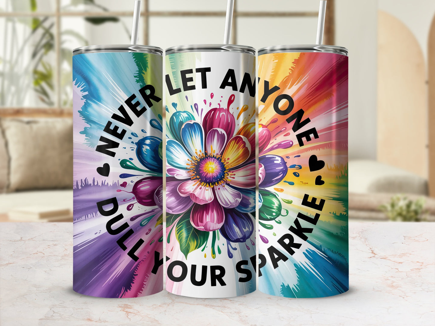 Three tumblers with colorful flower and heart designs, saying "Never dull your sparkle."