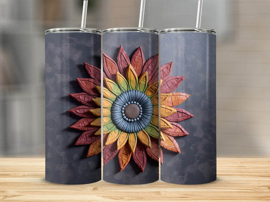Sunflower tumbler with textured petals and straw.