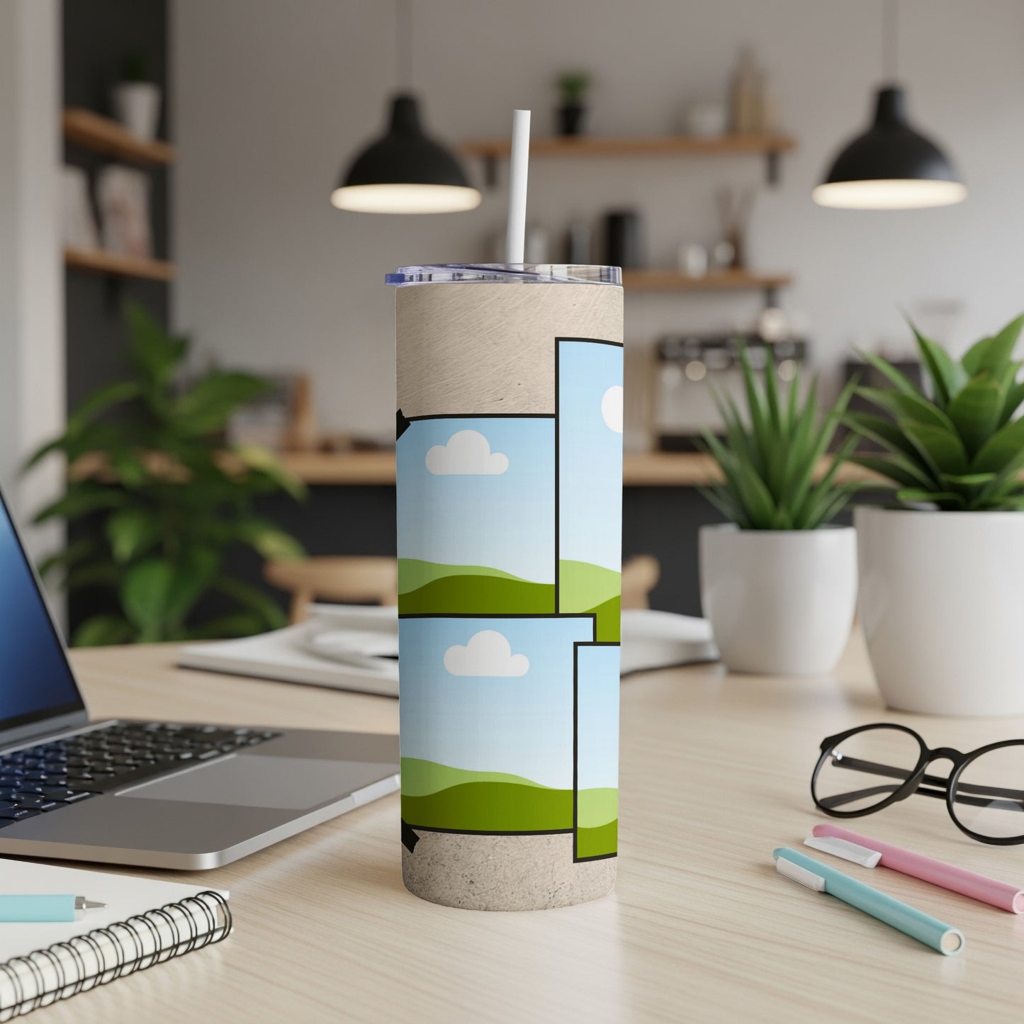 Tumbler with a beige texture and a stack of landscape photo frames with a straw.
