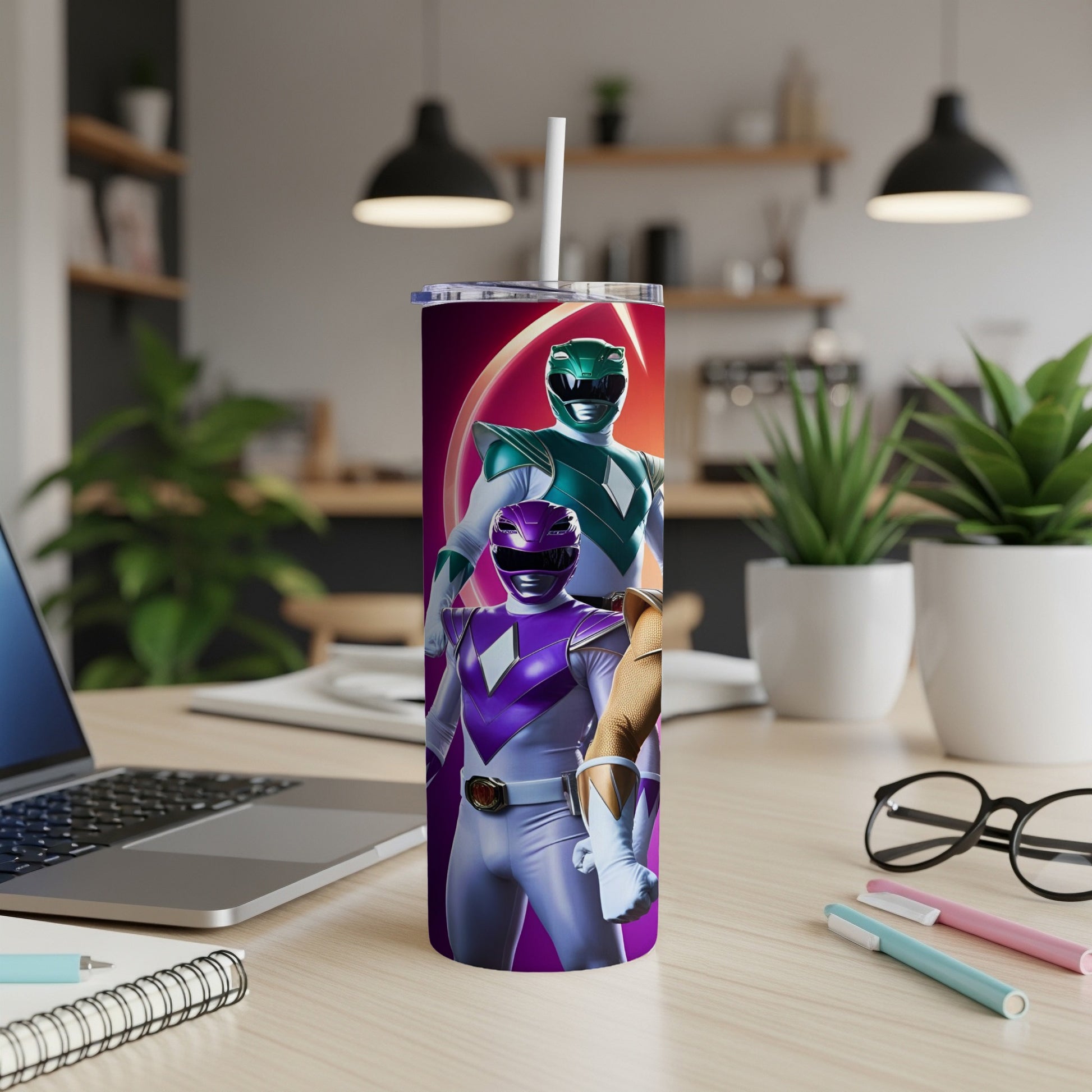 Purple and green Power Rangers on a purple and pink tumbler with a straw.