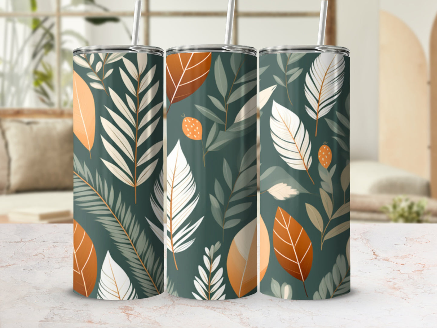 Three tall tumblers with a botanical leaf pattern in green, white, and orange.