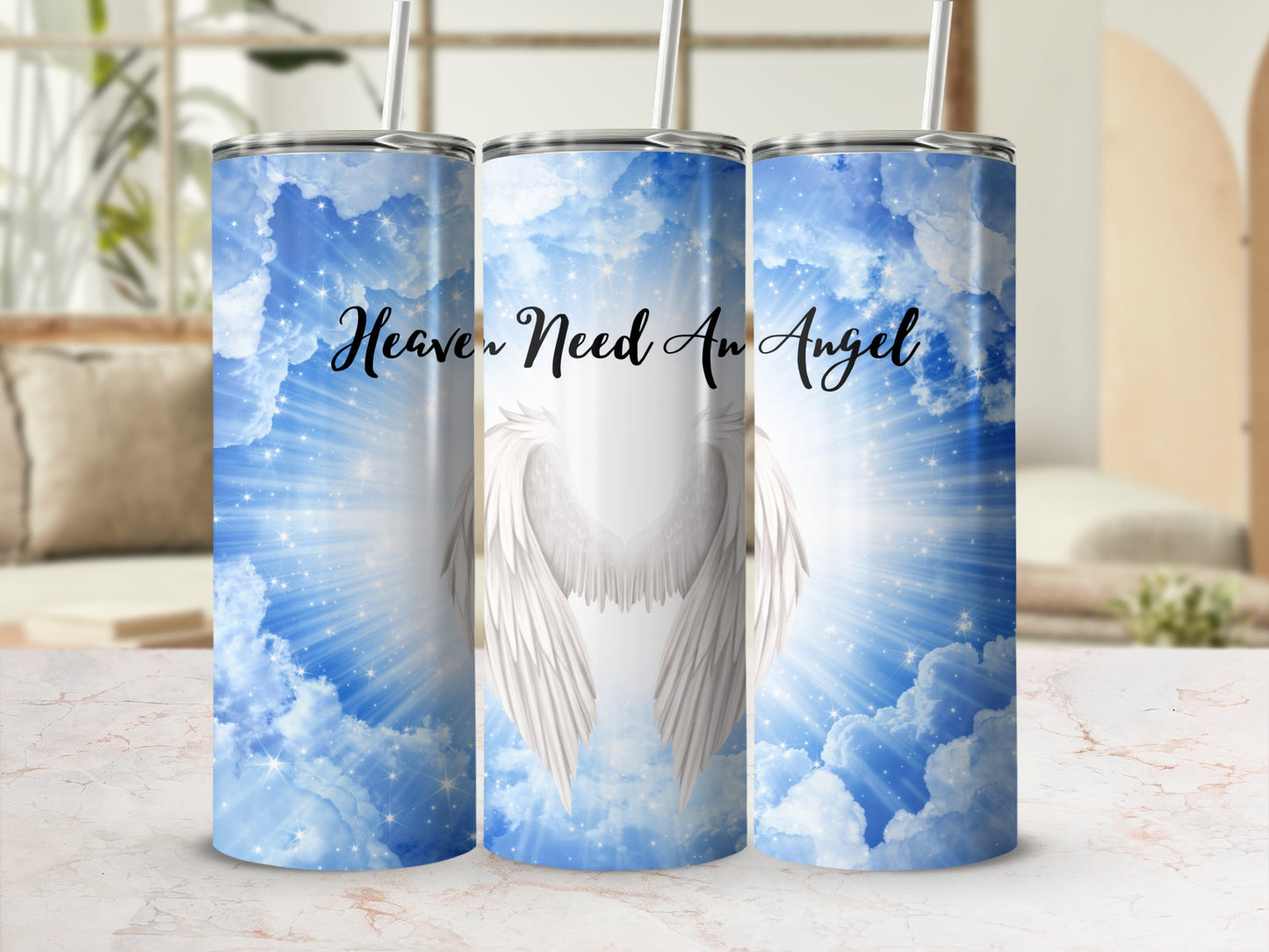 Heavenly wings and clouds design on a white tumbler.