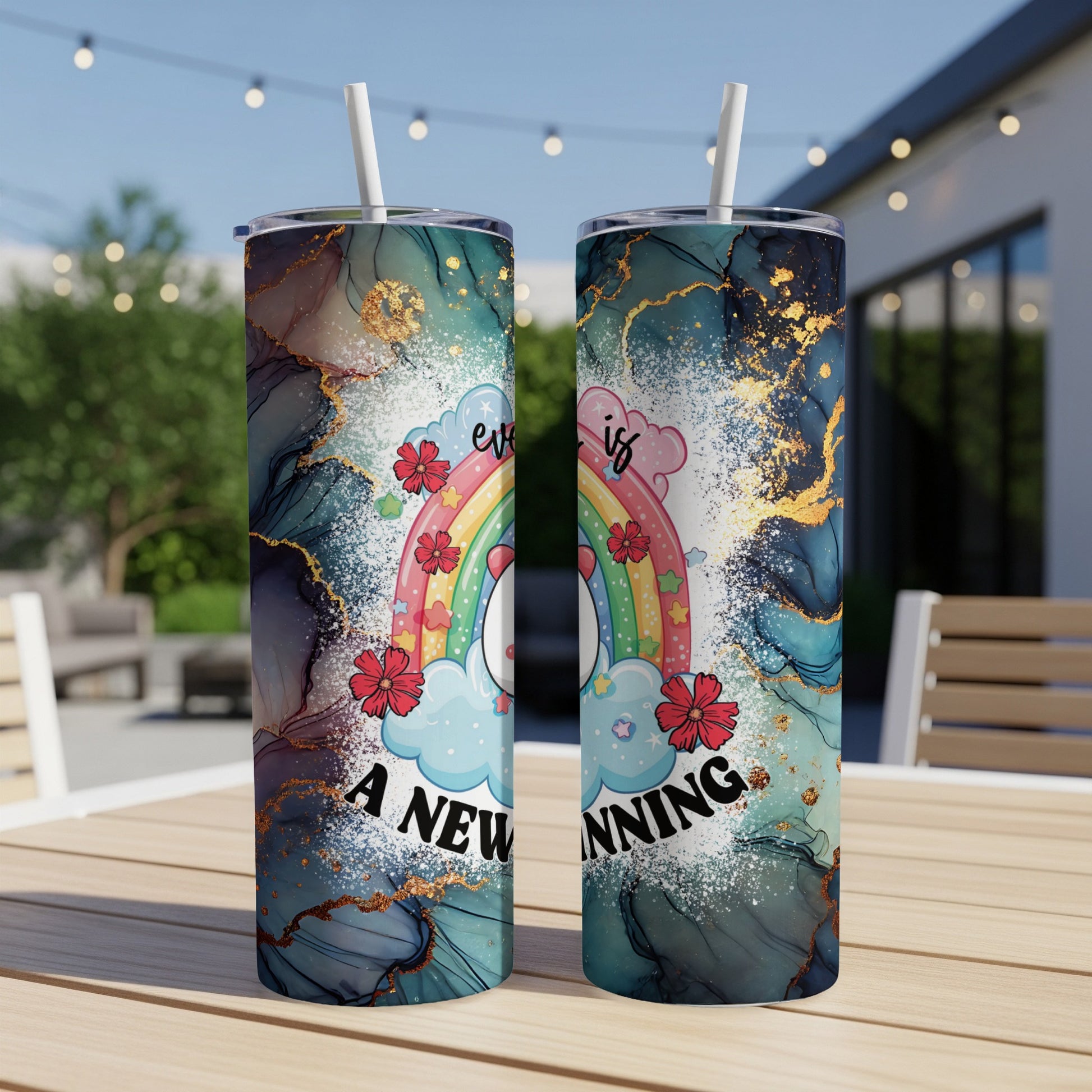 Rainbow and clouds with text "every is a new beginning" on a marbled tumbler.