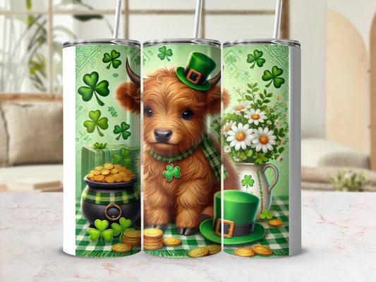 Cow wearing green hat and scarf sits near pot of gold and shamrocks.