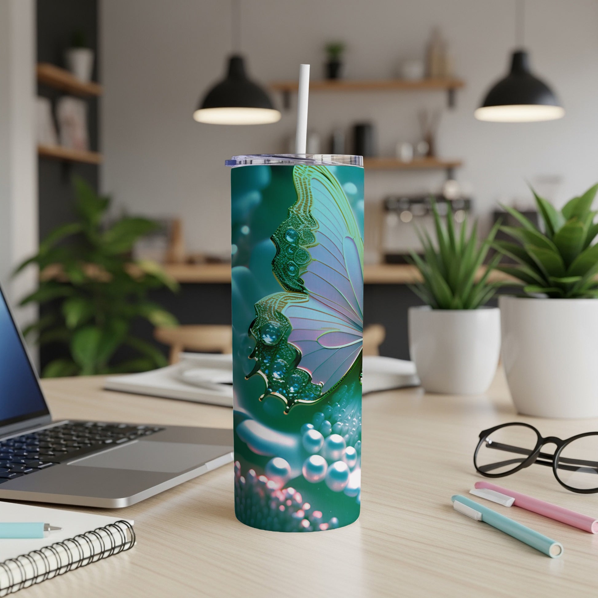 Teal tumbler with iridescent butterfly wing design and pearl accents.