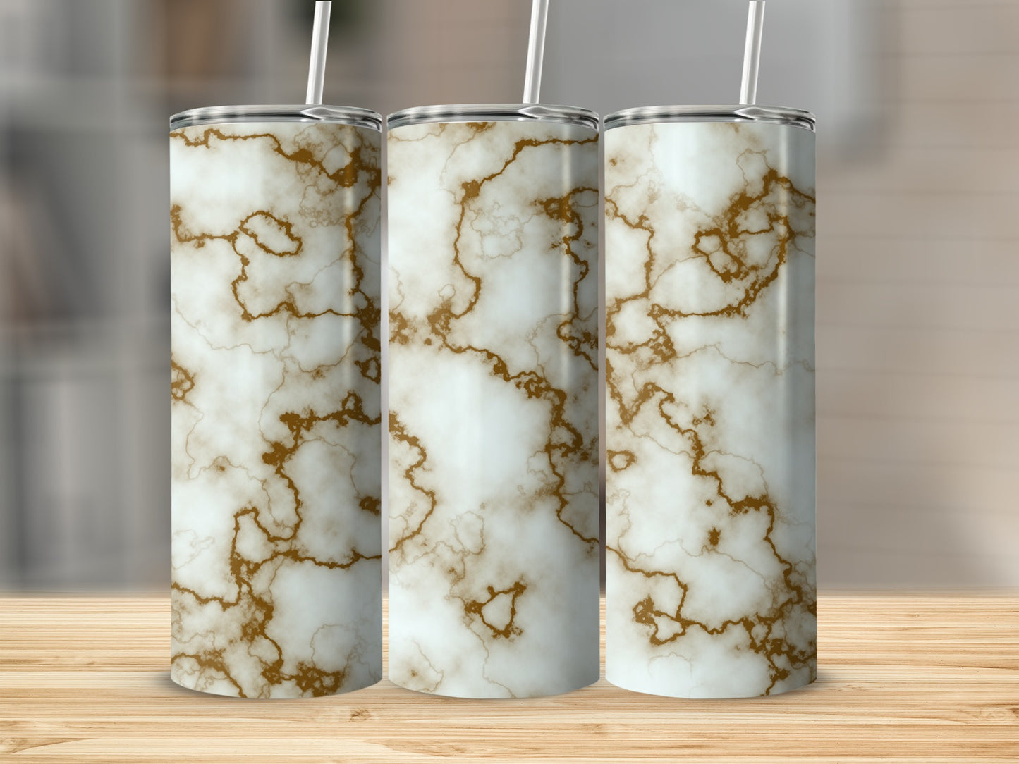 Three tall tumblers with white and gold marble pattern.
