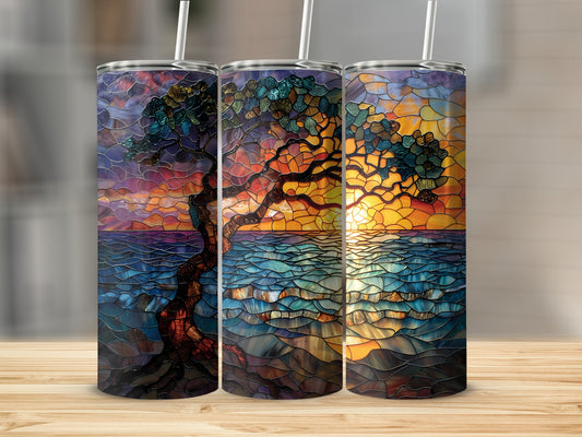 Three tumblers featuring a stained glass tree and sunset over water.