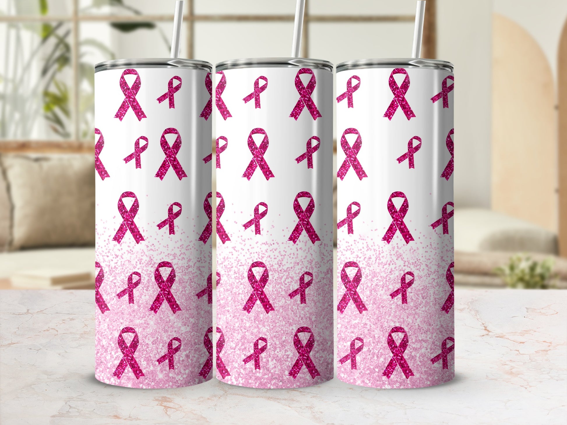 Three pink glitter cancer ribbon tumblers with straws, arranged in a row.