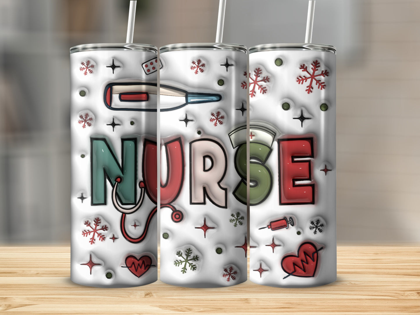 Three tumblers with nurse-themed graphics and snowflake accents.