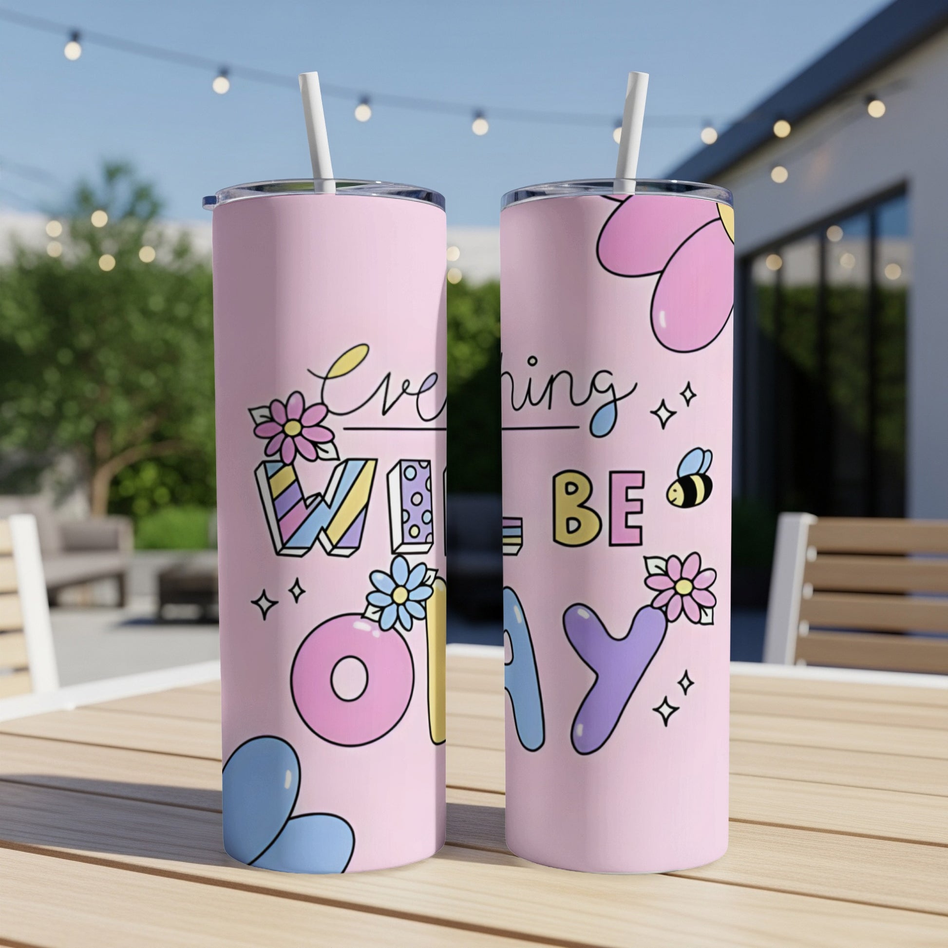 Pink tumbler with colorful "Everything Will Be Okay" text and floral designs.