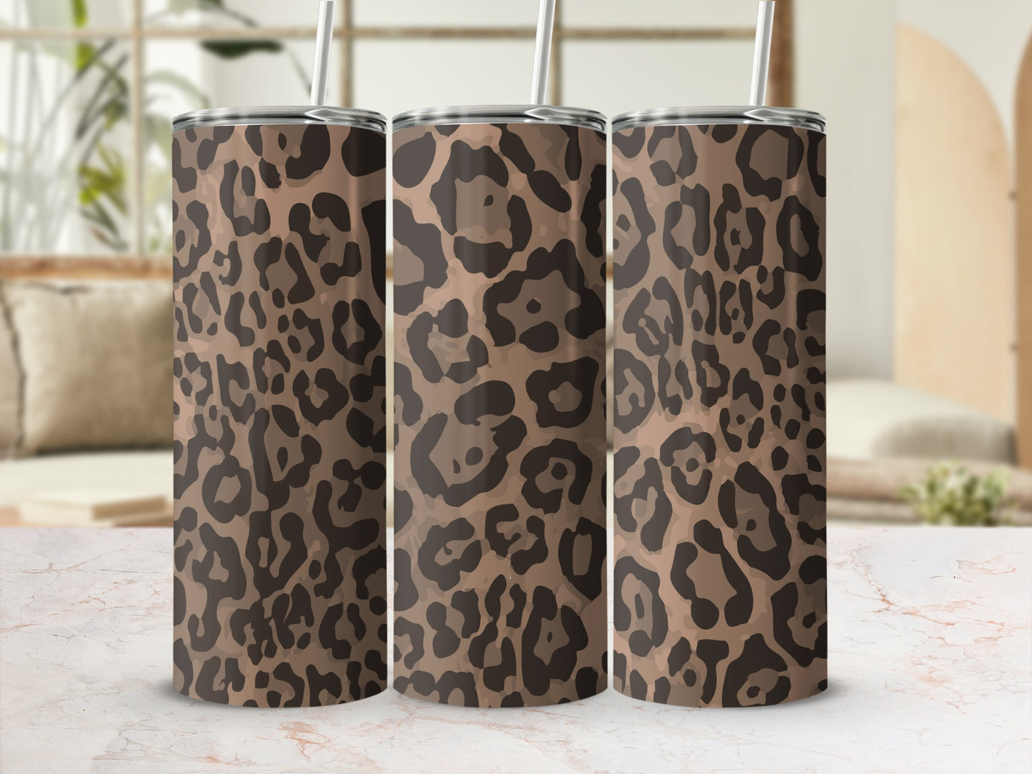 Three stainless steel tumblers with a brown and black leopard print pattern.
