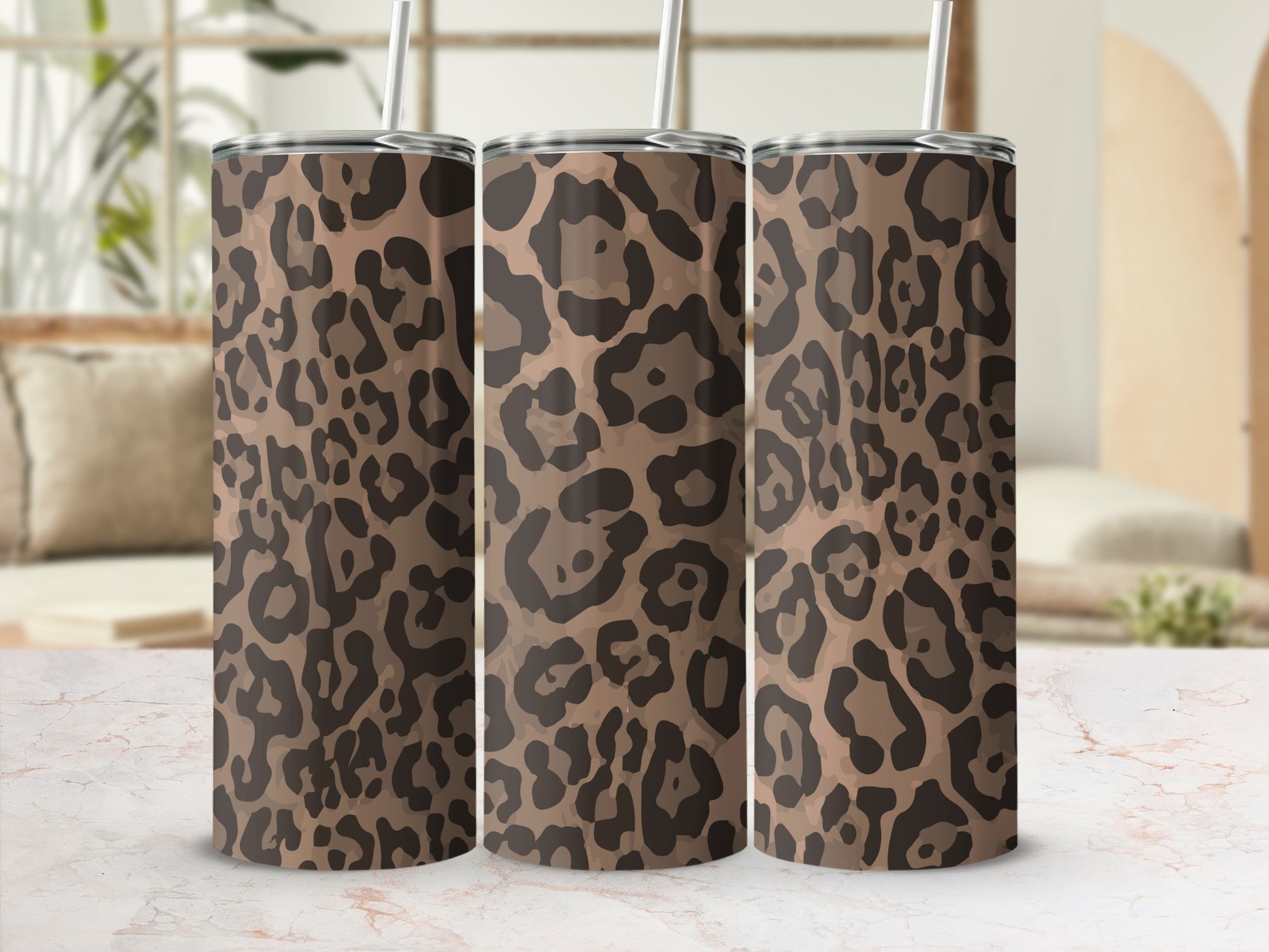 Three stainless steel tumblers with a brown and black leopard print pattern.