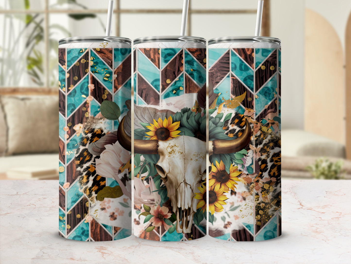 Three tumblers with a bull skull, sunflowers, and geometric patterns.