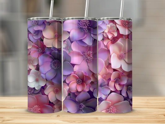Tumbler with a vibrant floral pattern in shades of pink and purple.