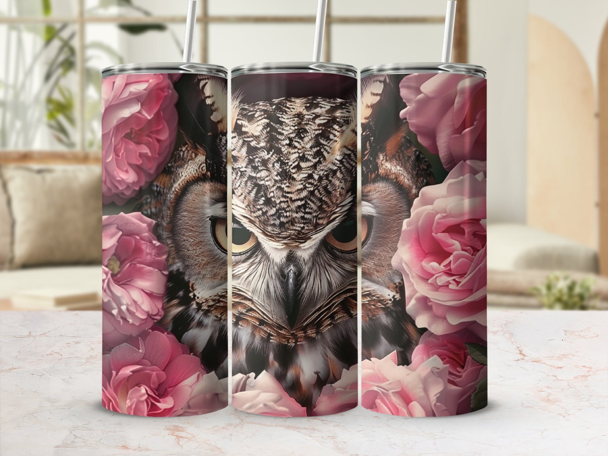 Great horned owl face surrounded by pink roses on a tumbler.
