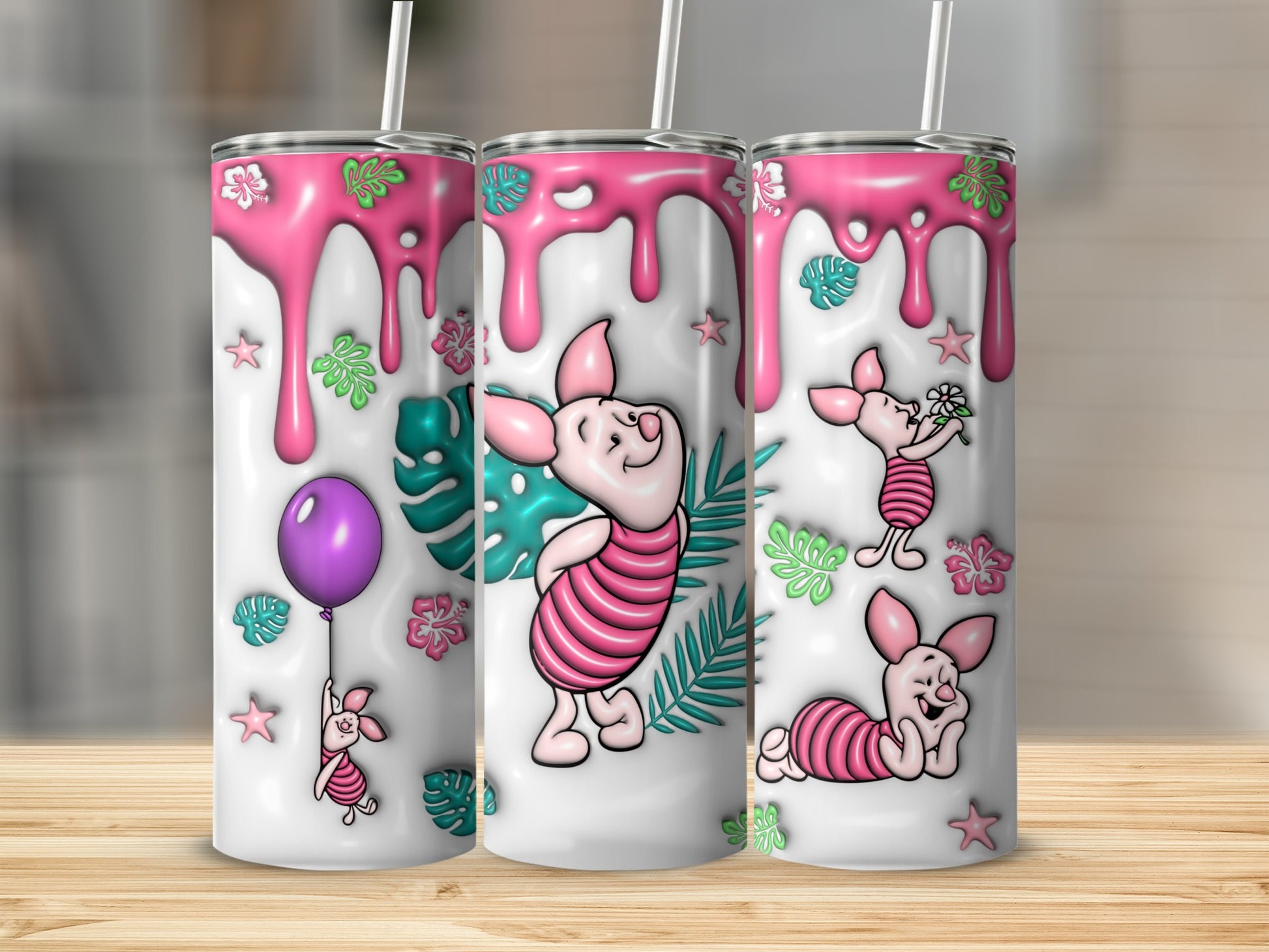 Piglet designs with pink drips and tropical leaves on three tumblers.