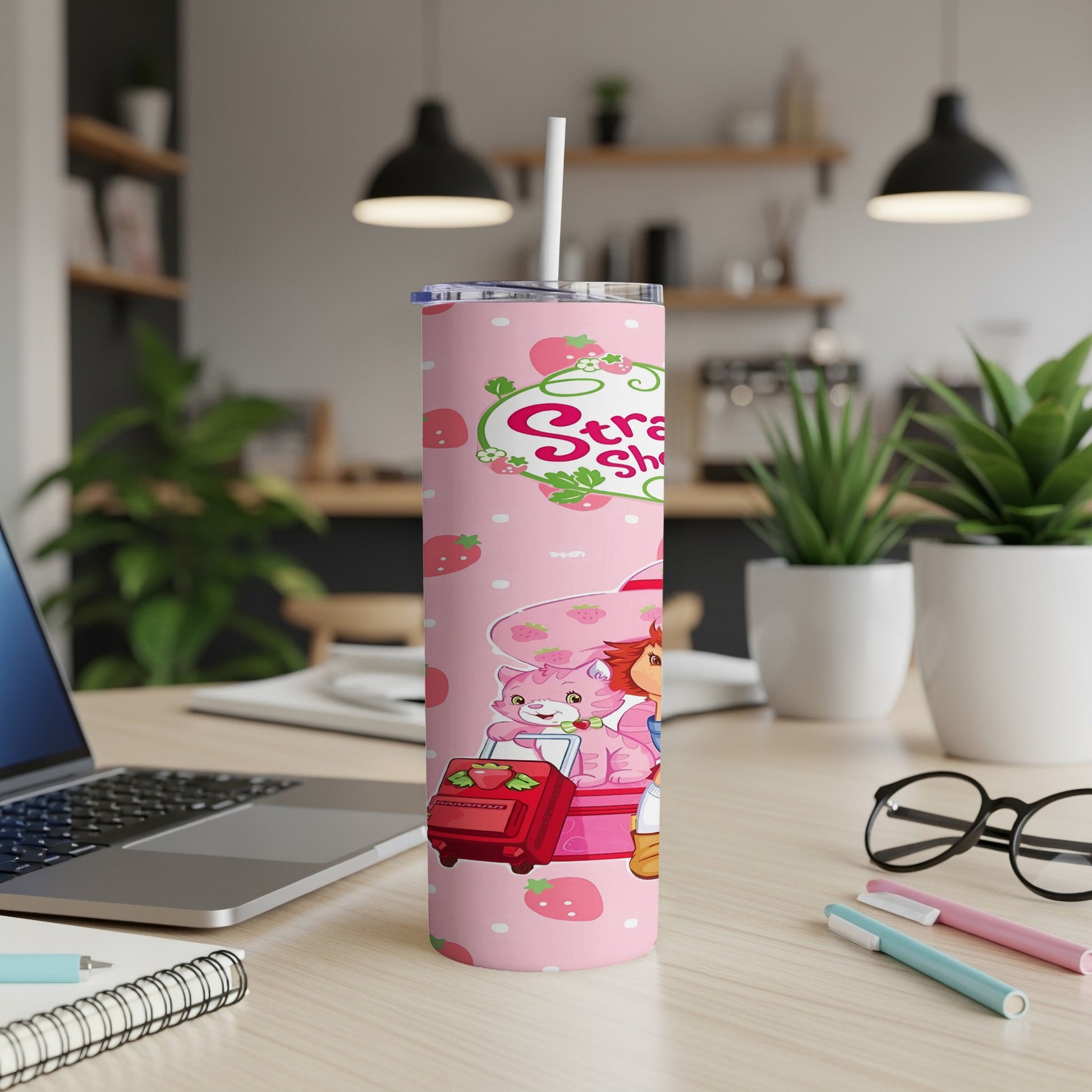 Strawberry Shortcake and her friends on a pink travel tumbler.