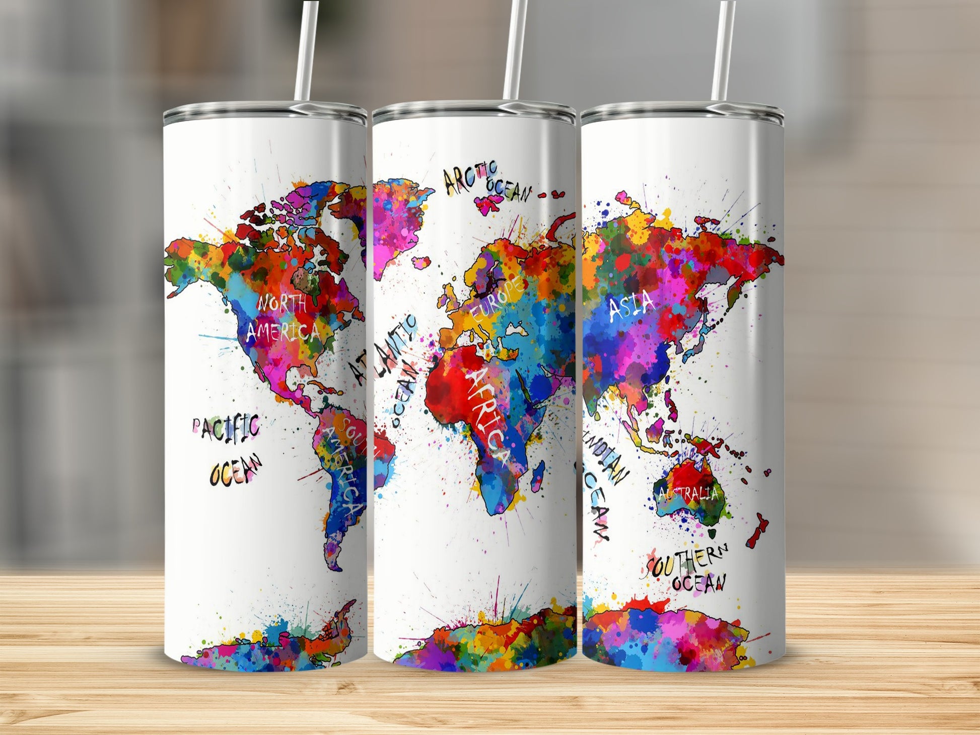 Three tumblers display a colorful watercolor world map with oceans labeled.