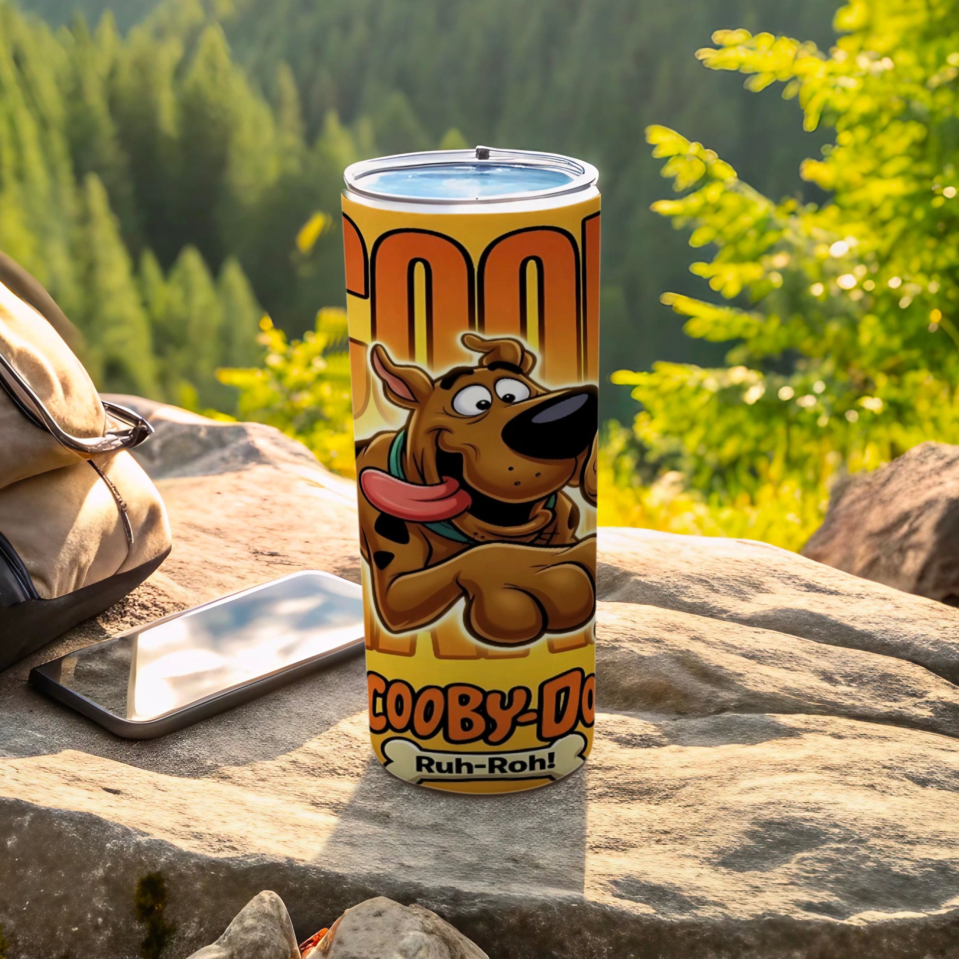 Scooby-Doo "Ruh-Roh!" tumbler with cartoon character, outdoors.