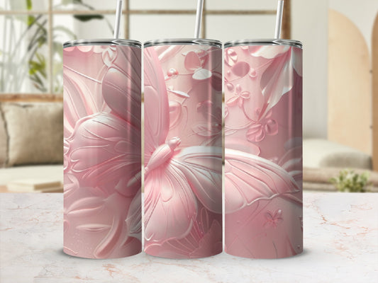 Pink butterfly and floral design on three tumblers with straws.