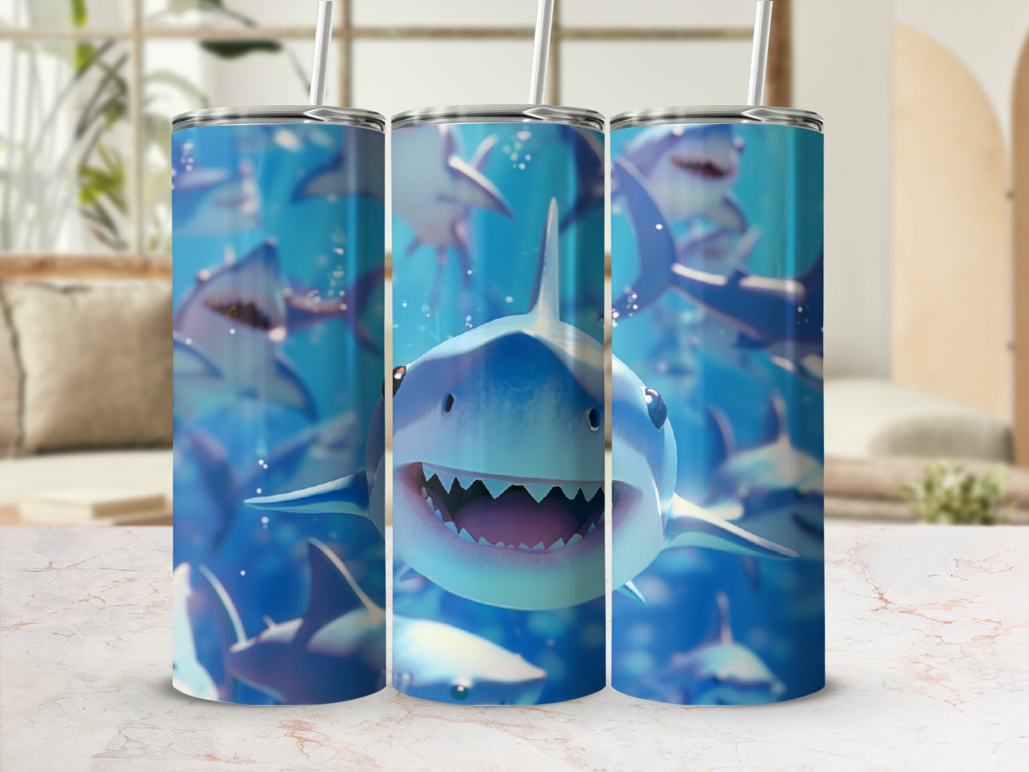 Three tumblers with cartoon sharks swimming underwater.