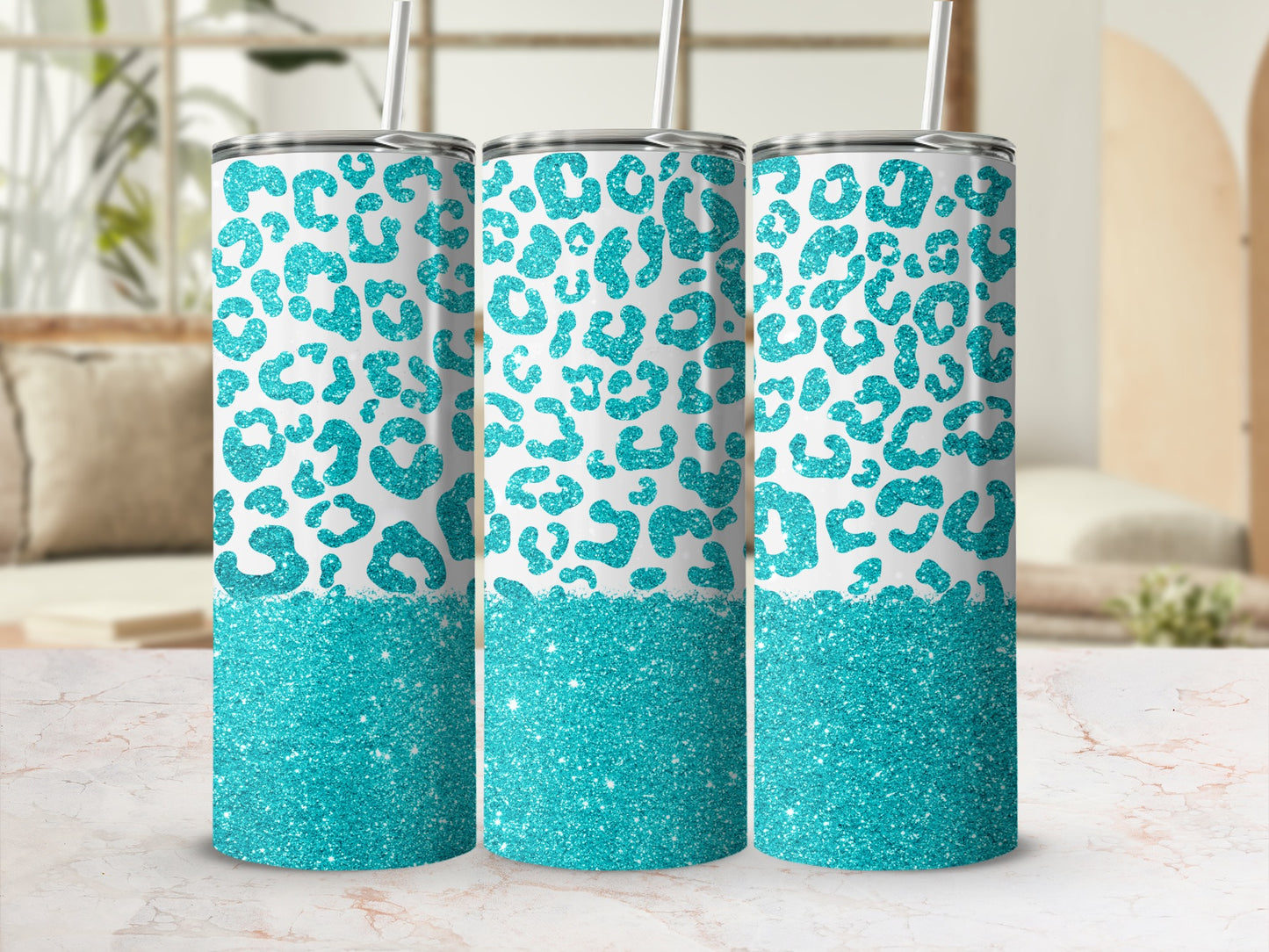 Three teal leopard print tumblers with glitter bases.