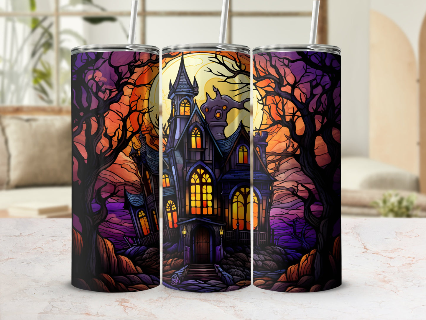 Haunted house with spooky trees and moon, displayed on a marble countertop.