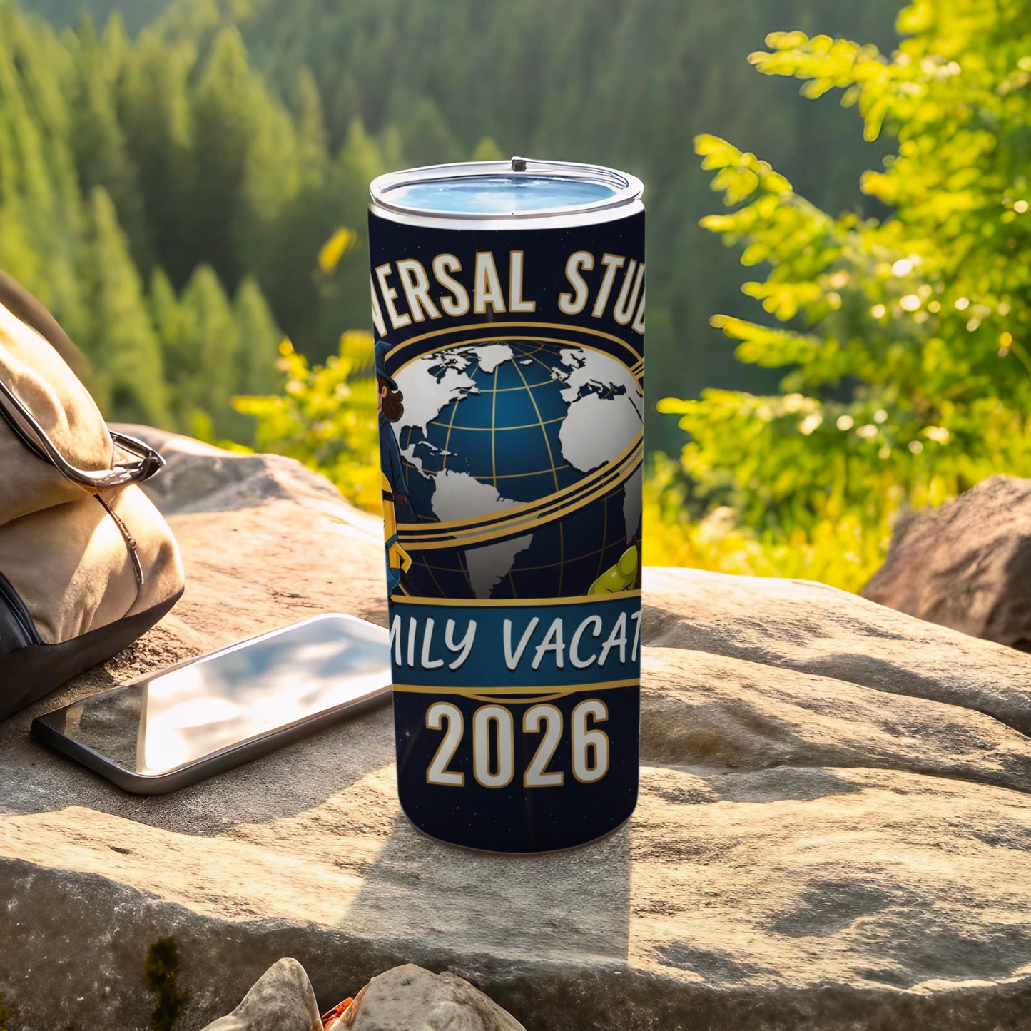 Universal Studios family vacation 2026 tumbler on rocky ground with backpack and phone.