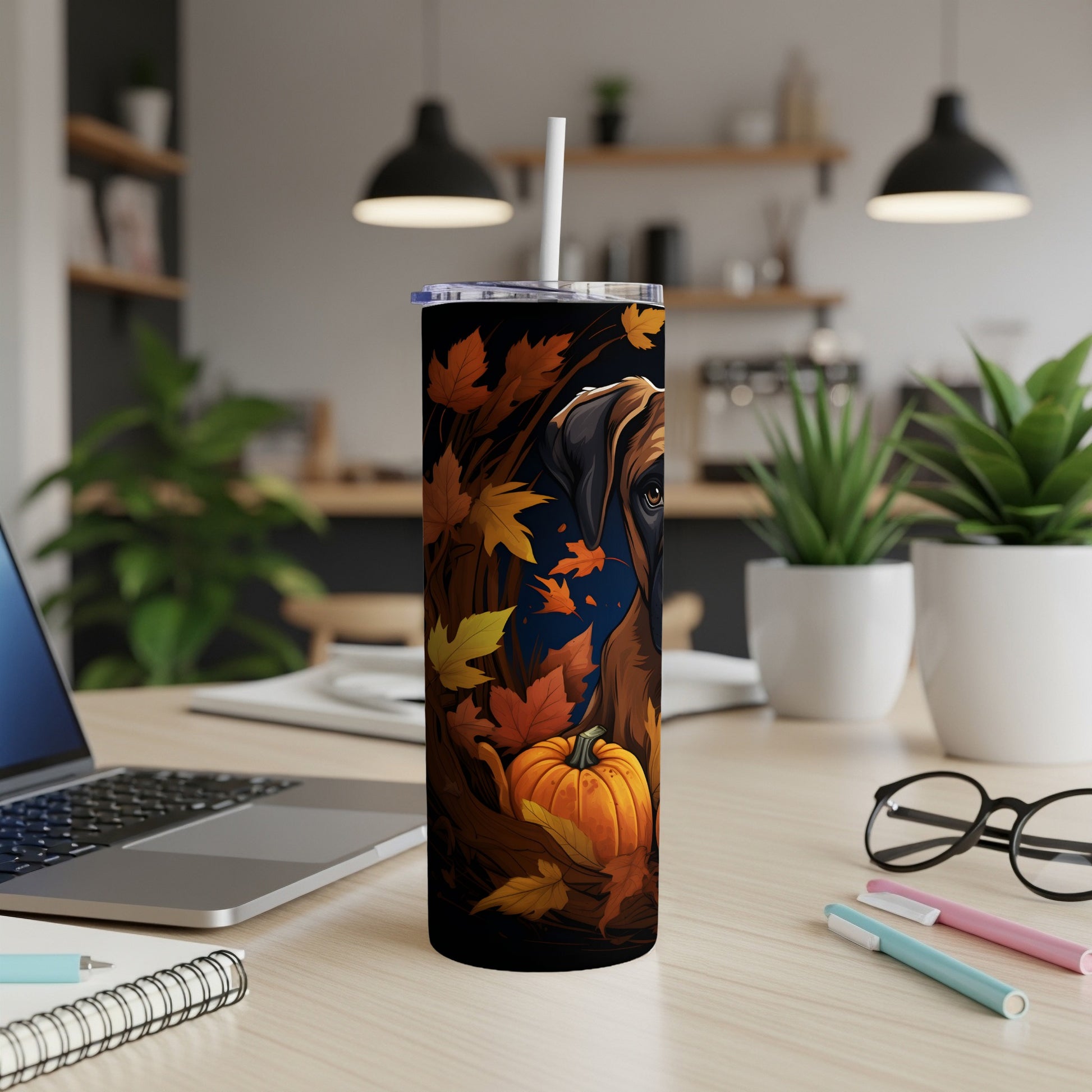 Tumbler with dog and autumn leaves design, featuring a pumpkin.