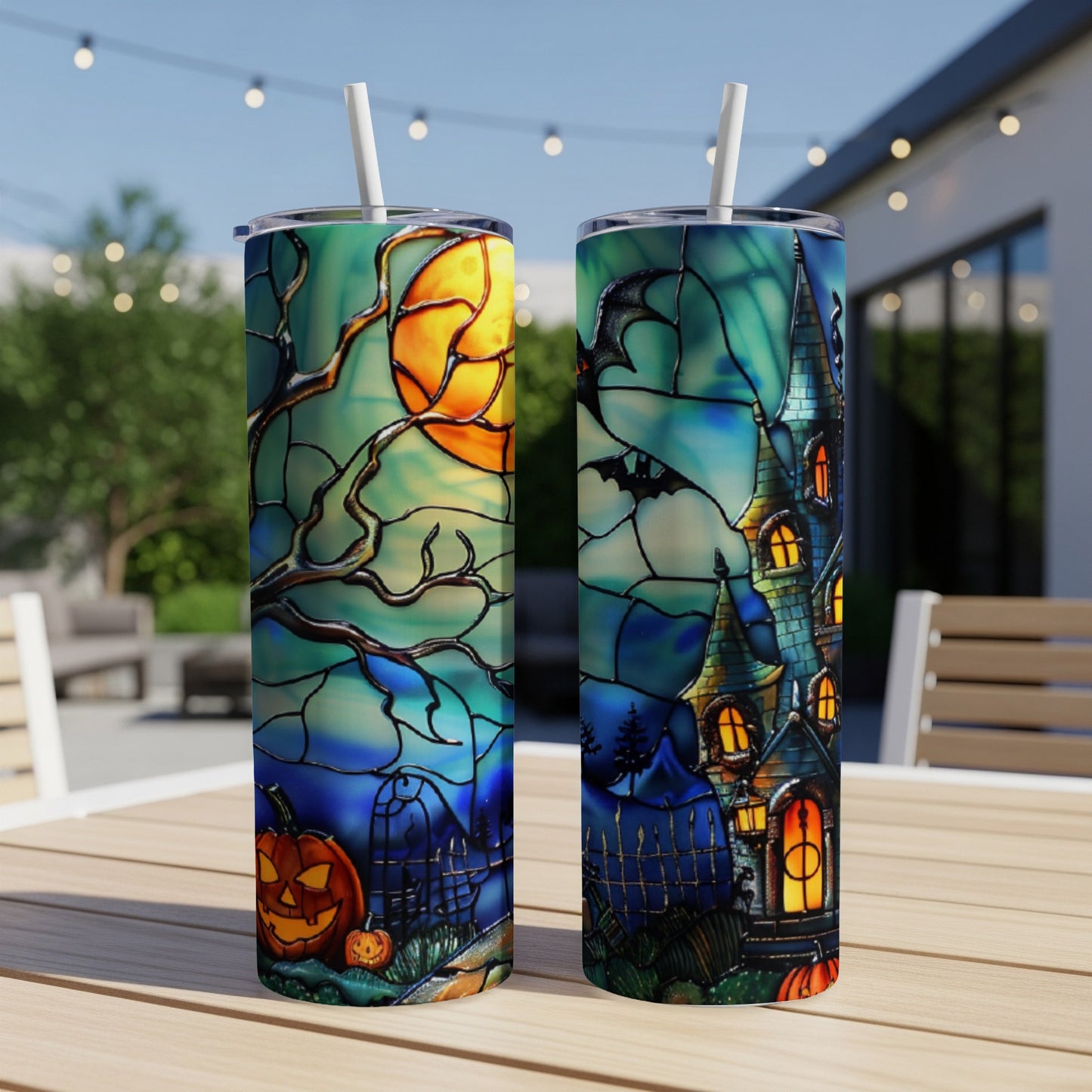 Halloween tumbler with spooky castle and pumpkin design.