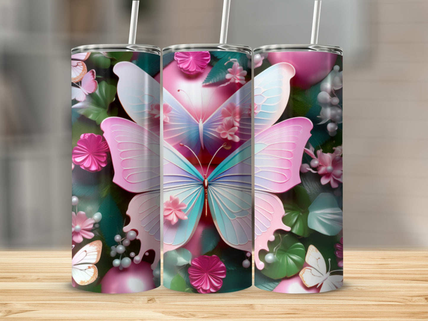 Three tumblers with pastel butterflies and floral designs.