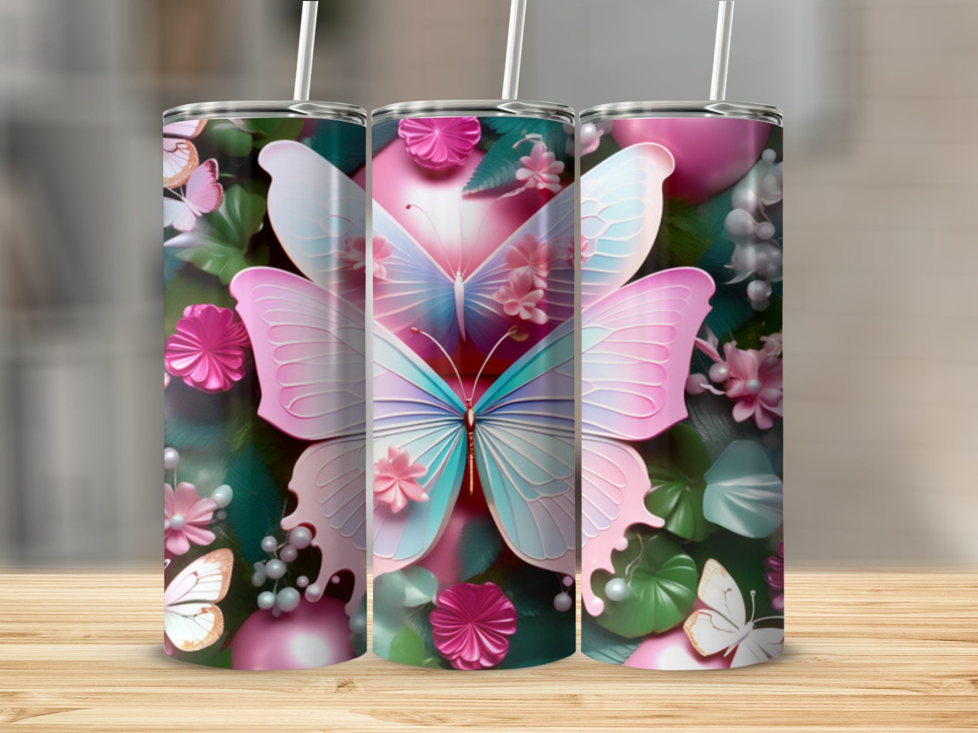 Three tumblers with pastel butterflies and floral designs.