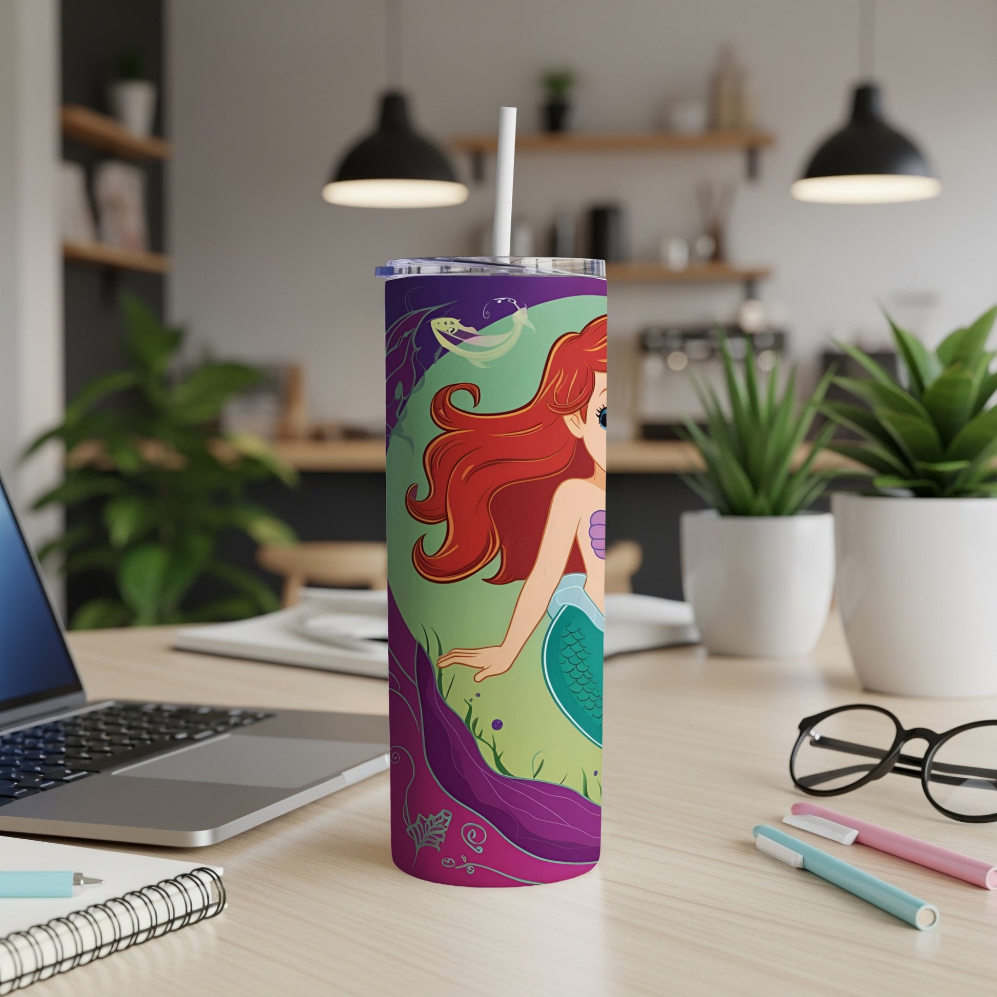 Ariel the Little Mermaid on a green and purple themed tumbler with straw.
