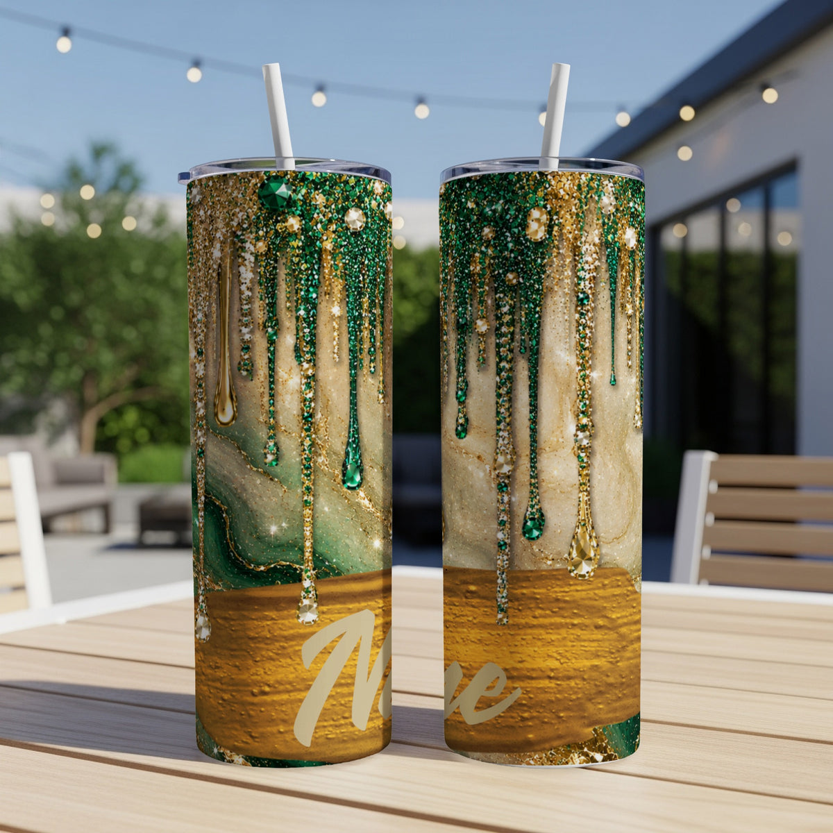 Two tumblers with dripping green and gold glitter designs and personalized "Mae" text.
