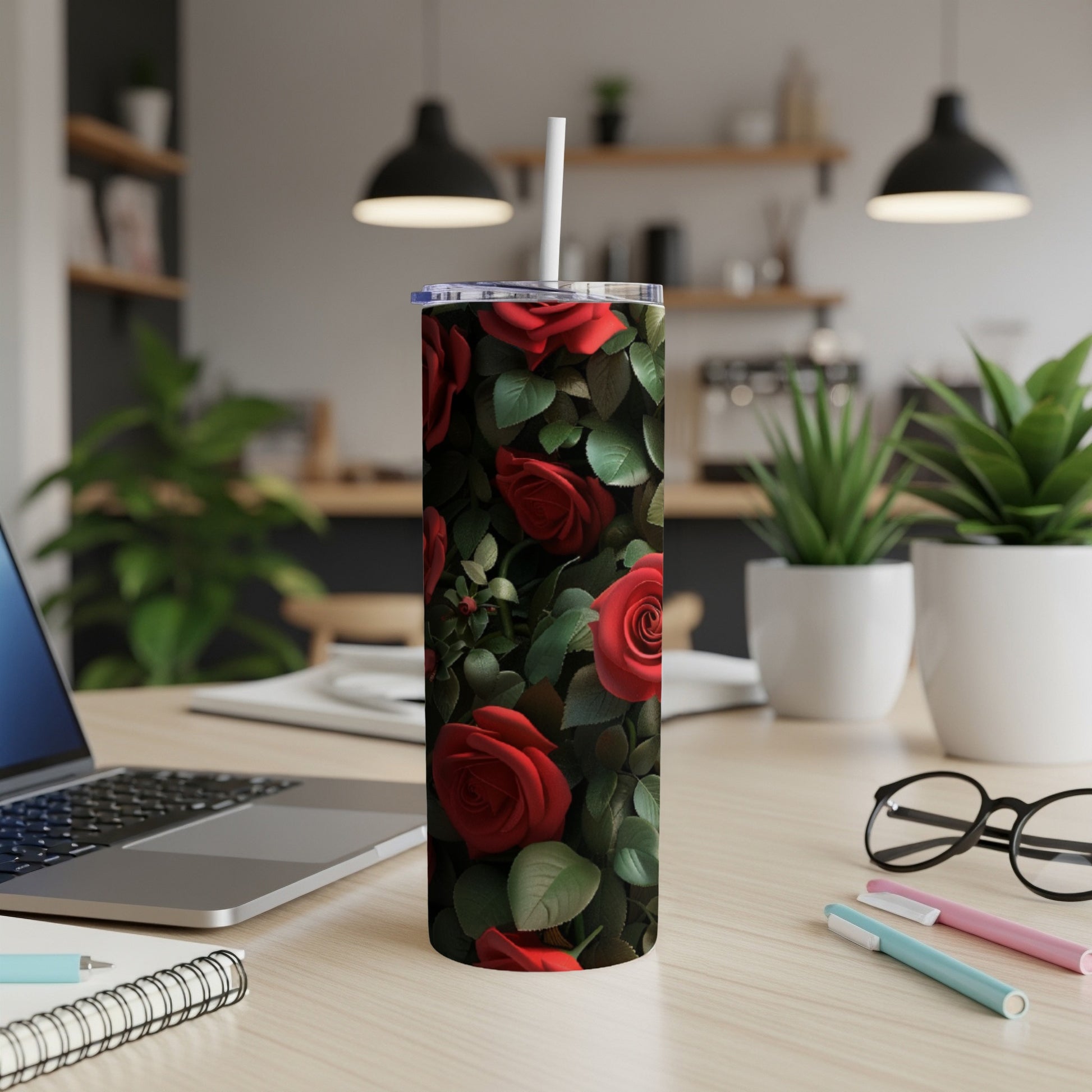 Red roses pattern on a white insulated tumbler with a straw.