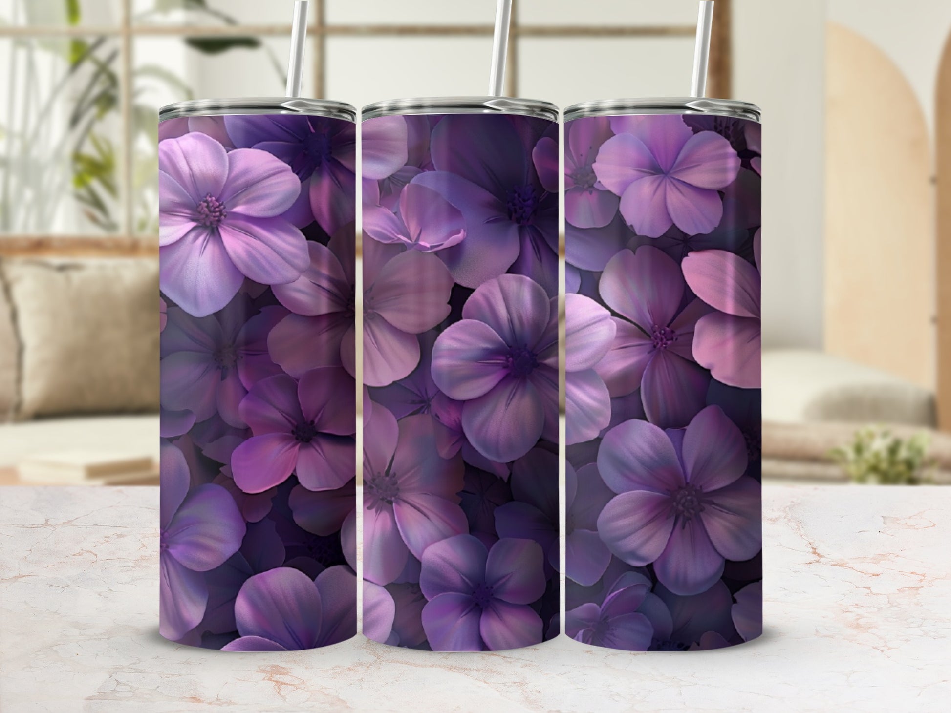 Three tumblers with a purple floral pattern against a blurred background.