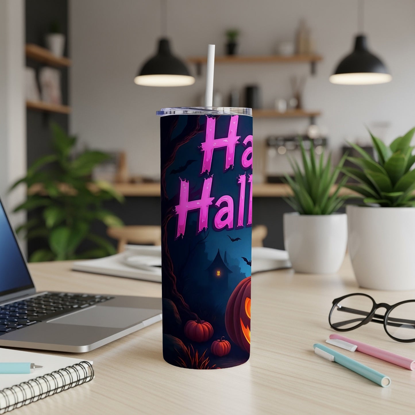 Tumbler with pink "Happy Halloween" text, bats, and pumpkins on a dark blue background.