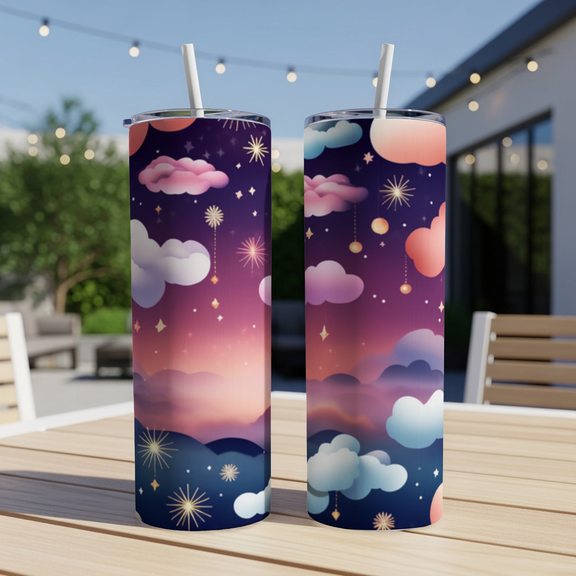 Two tall tumblers with a starry night sky and cloud design.