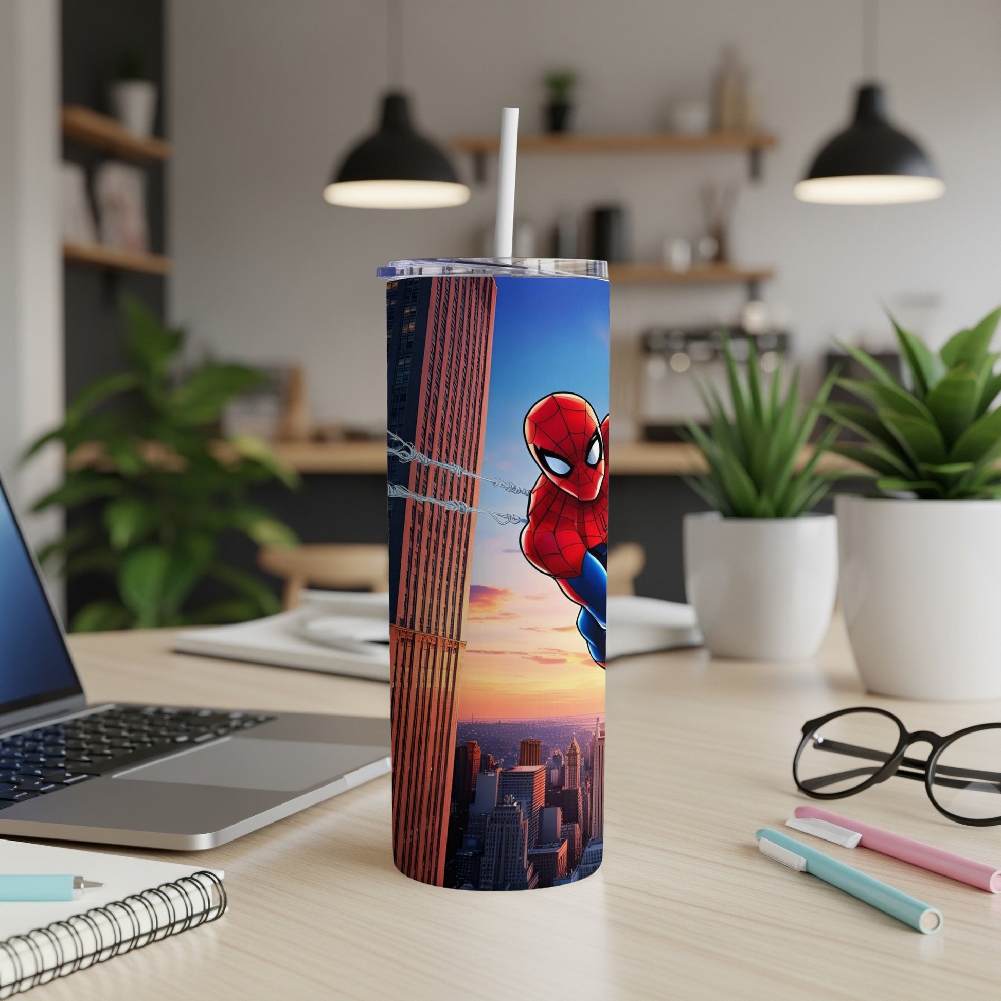 Spiderman on a cityscape on a white tumbler with a straw.