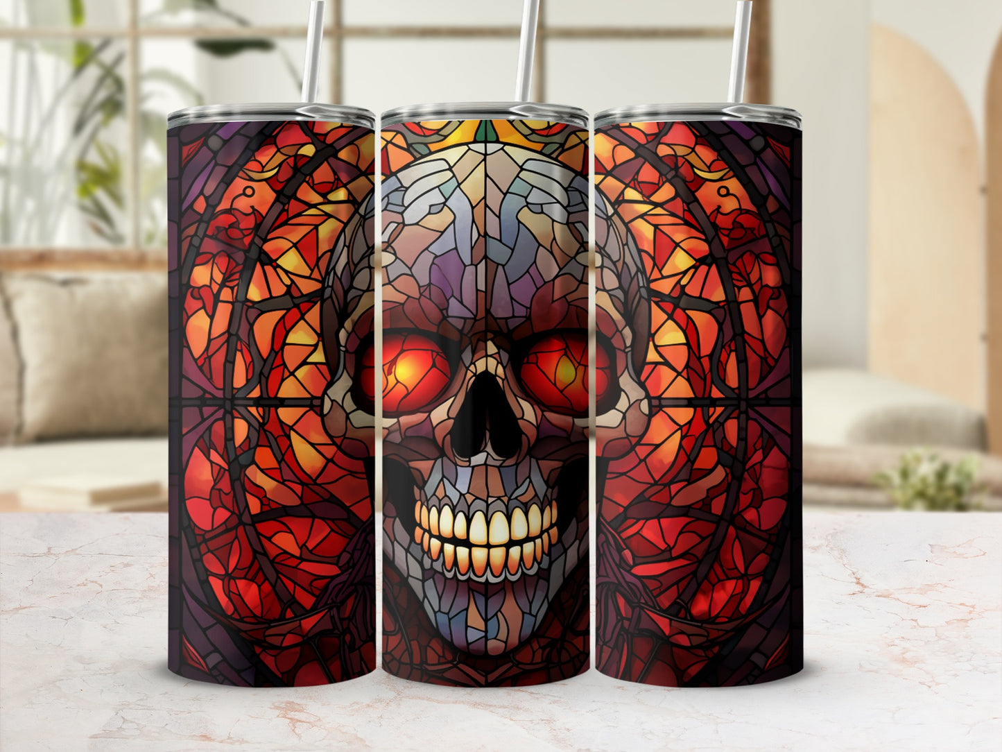 Three tumblers with a stained-glass skull design and glowing red eyes.