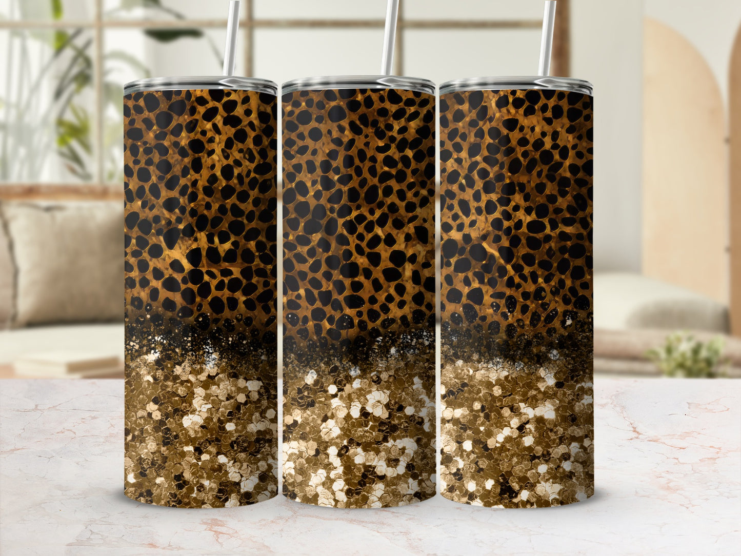 Three tumblers with leopard print and gold glitter design.