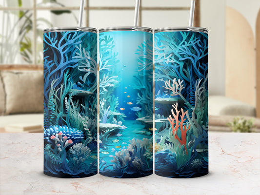 Three tumblers decorated with a vibrant underwater coral reef scene and small fish.