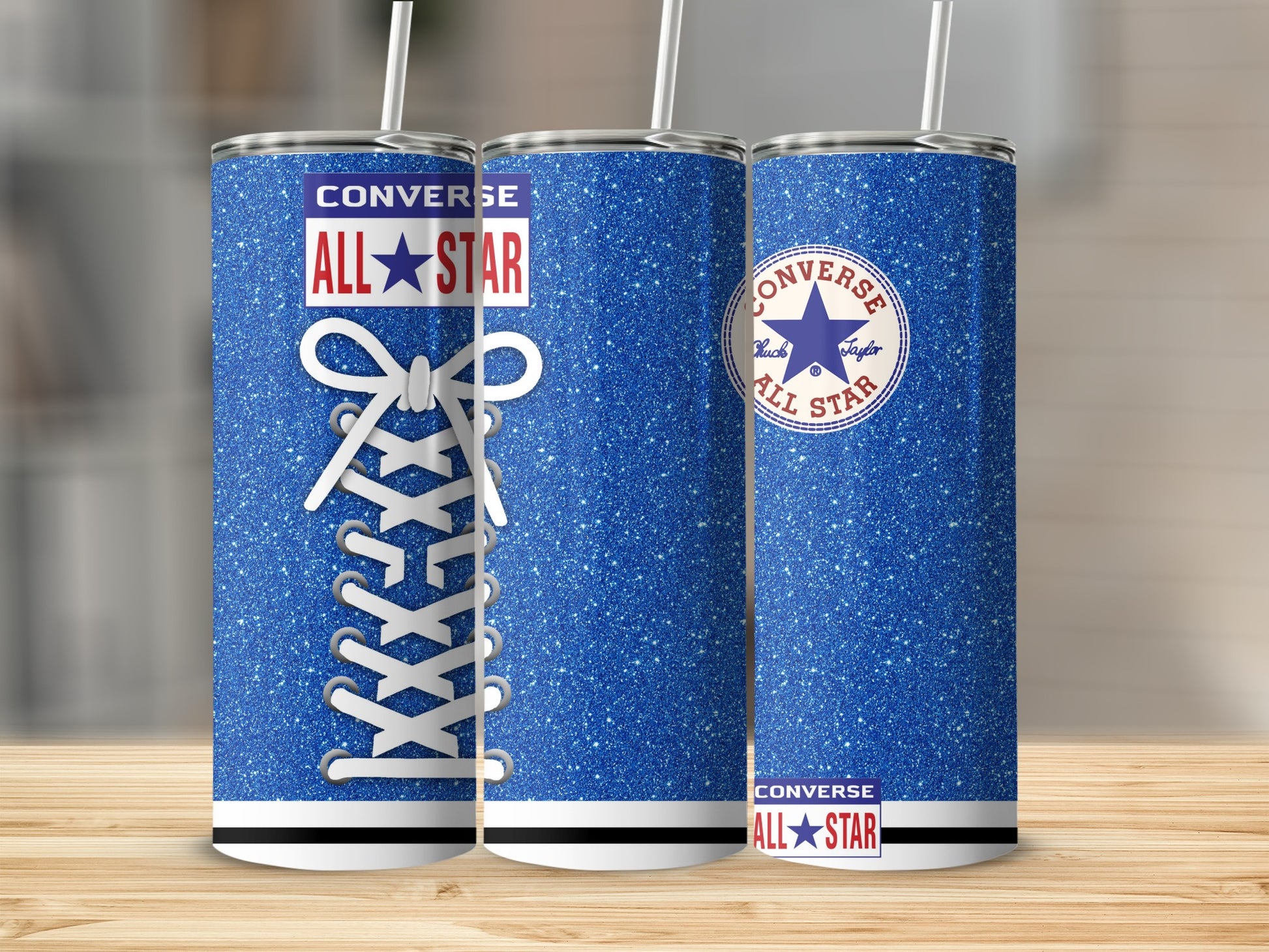 Three blue glitter Converse tumblers with white laces and logos.