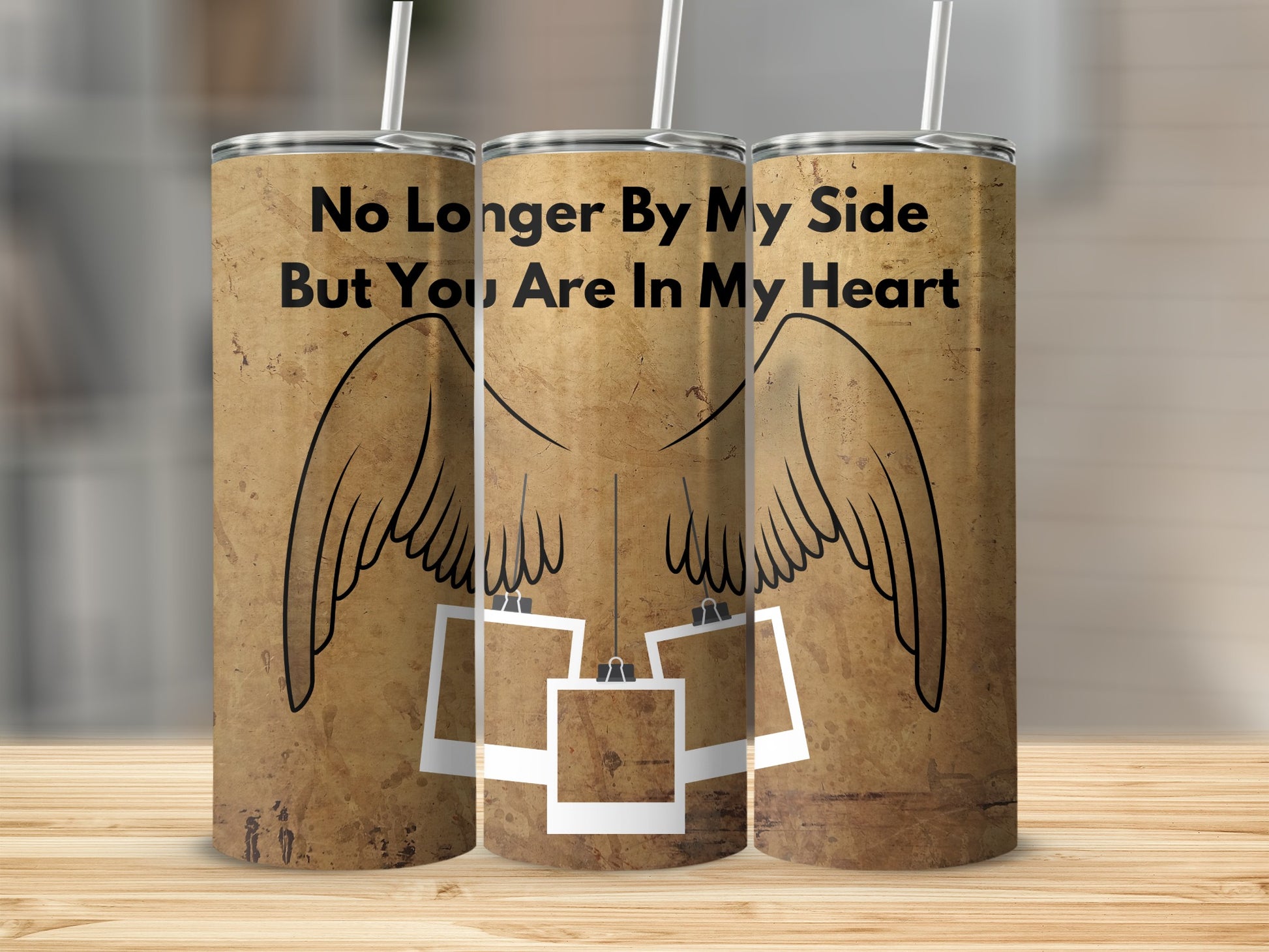 Three tumblers with angel wings and photos, reading "No Longer By My Side But You Are In My Heart."