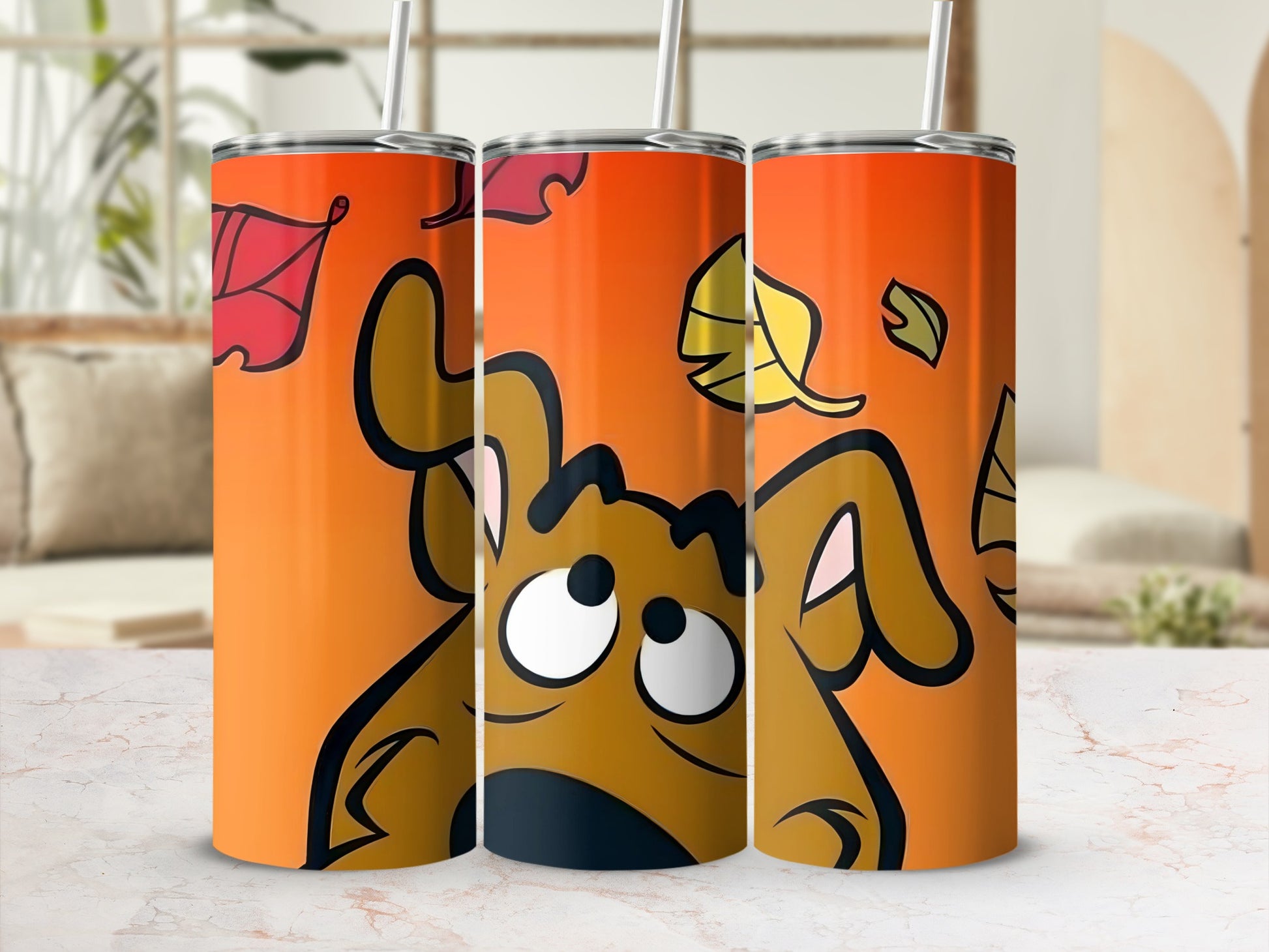 Scooby-Doo tumbler with autumn leaves against an orange background.